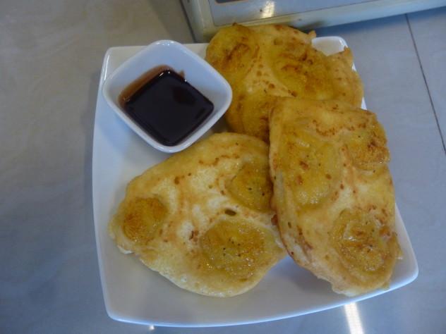 golden brown Peruvian pancakes made with 3 simple ingredients, served on a white plate.