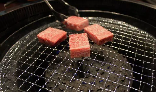 Affordable Kobe beef in Kobe putting marbled meat with tongs