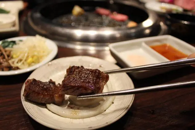 Affordable Kobe beef in Kobe side shot of meat dipped in sauce