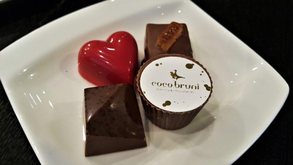 coco bruni chocolate truffles closeup raspberry bonbons