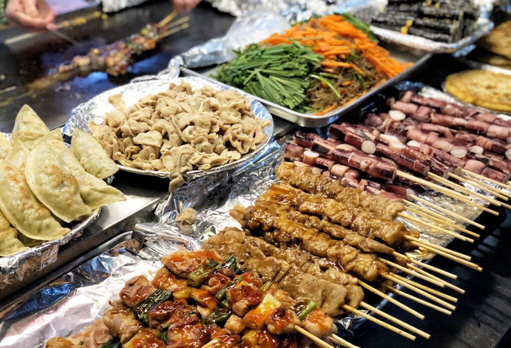 Variety of different Korean street foods including barbeque and others.