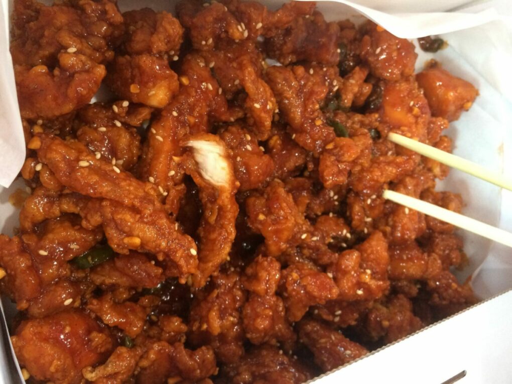 Deep fried boneless chicken covered with sweet and spicy sauce topped with sesame seeds.