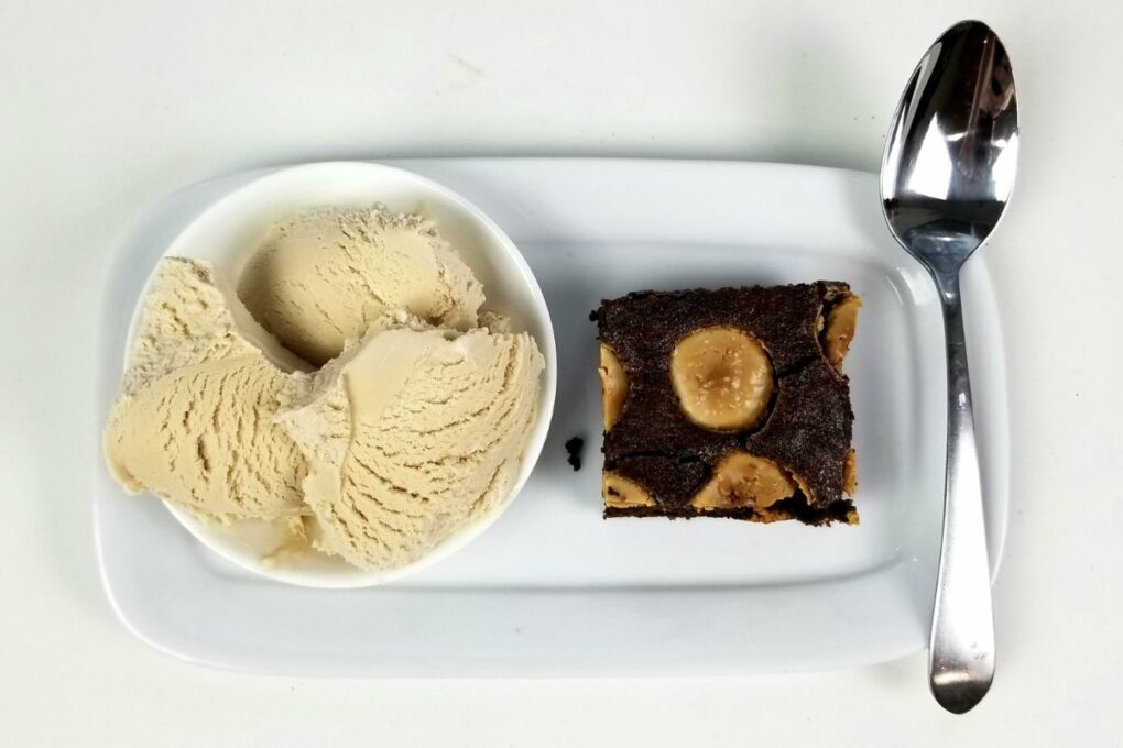 A plate of freshly baked Lazy Girl Brownies, a simple and quick chocolate snack recipe.