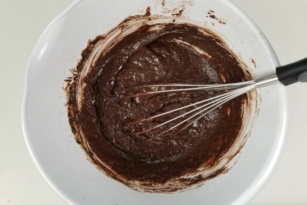 Mixing ingredients for box brownies to improve flavor and texture—first step in making box brownies better.