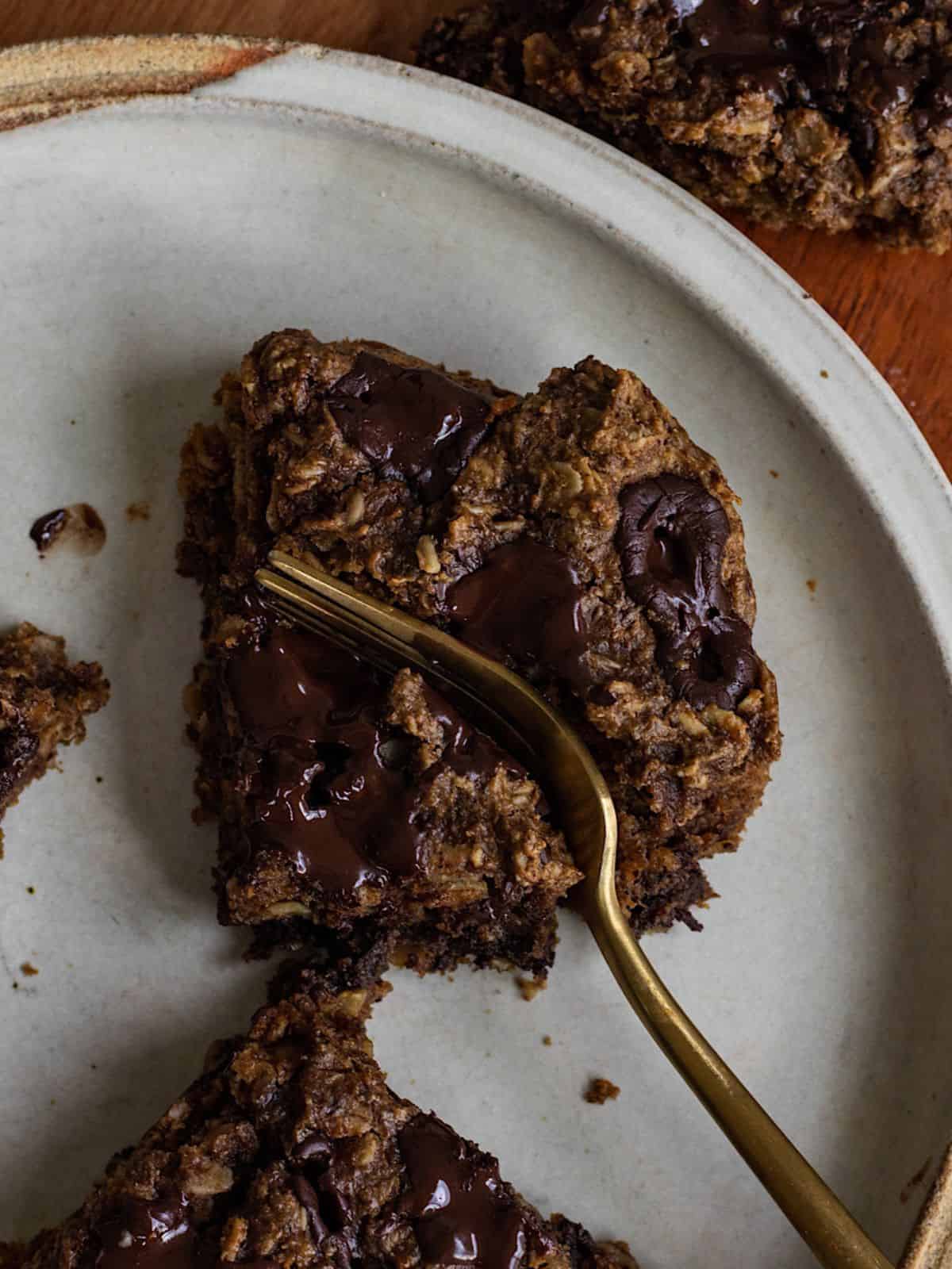 Vegan Oatmeal Chocolate Chip Blondie Bars on a plate.