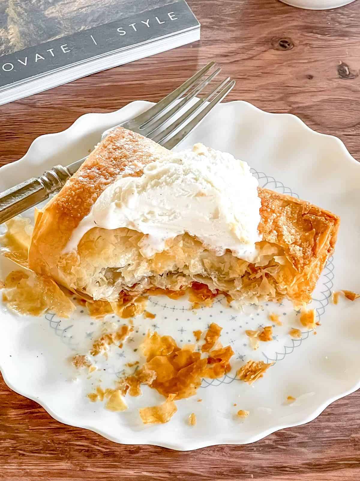 Apple strudel with apple filling covered in phyllo pastry.