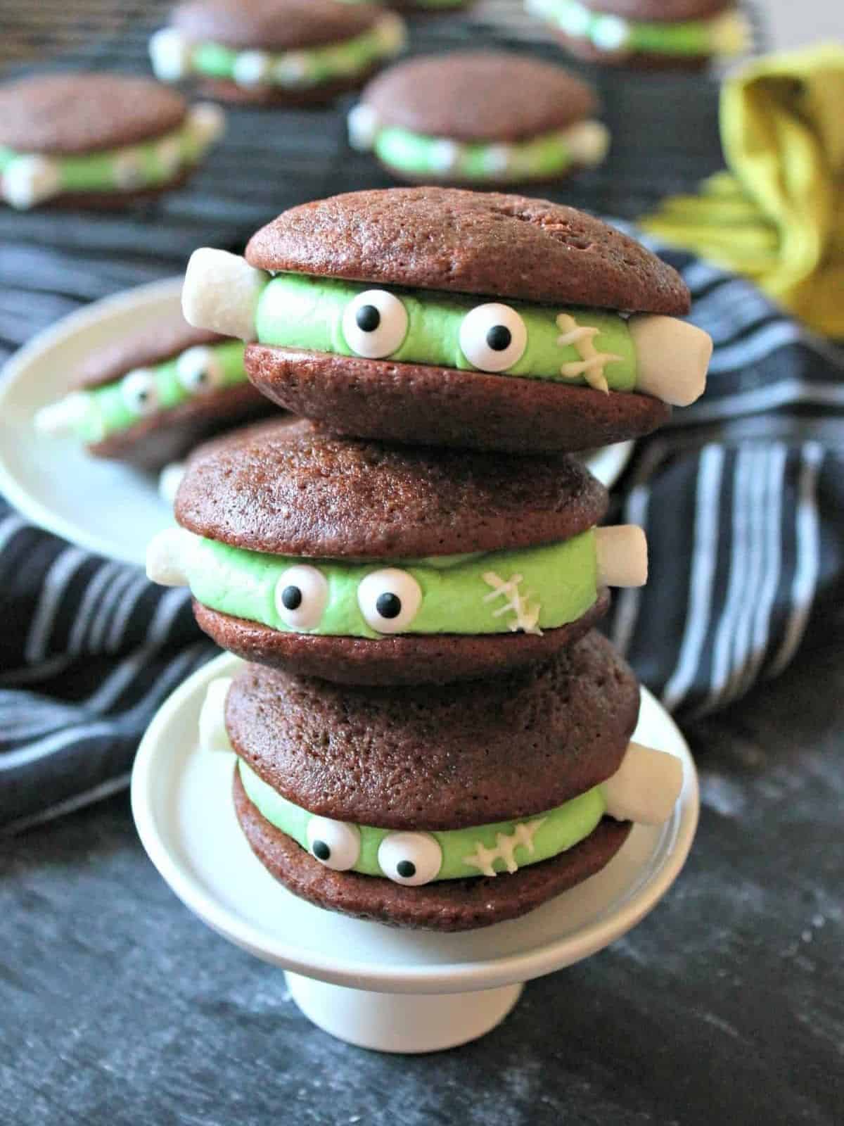 Frankenstein Chocolate Whoopie Pie with spooky green frosting and candy eyes, perfect for Halloween.