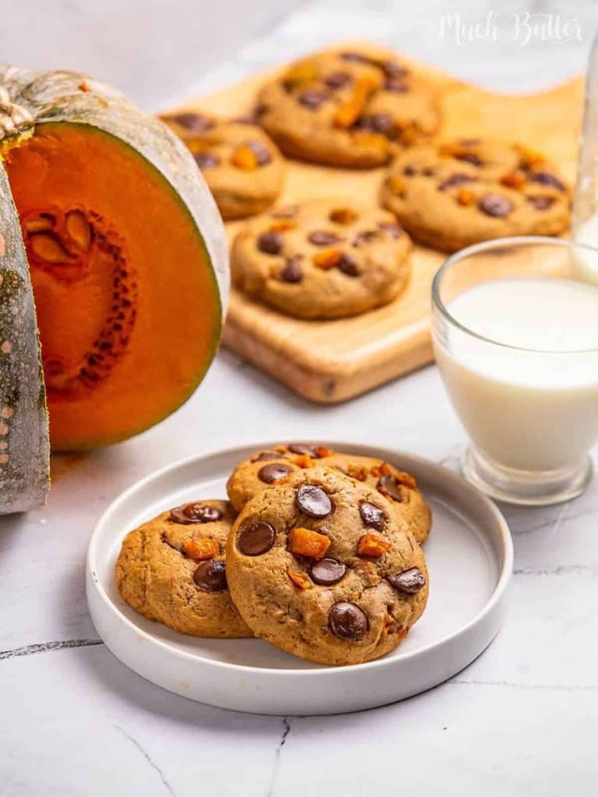 Pumpkin chocolate chip cookies on a spooky Halloween-themed plate, perfect for Halloween dessert ideas.