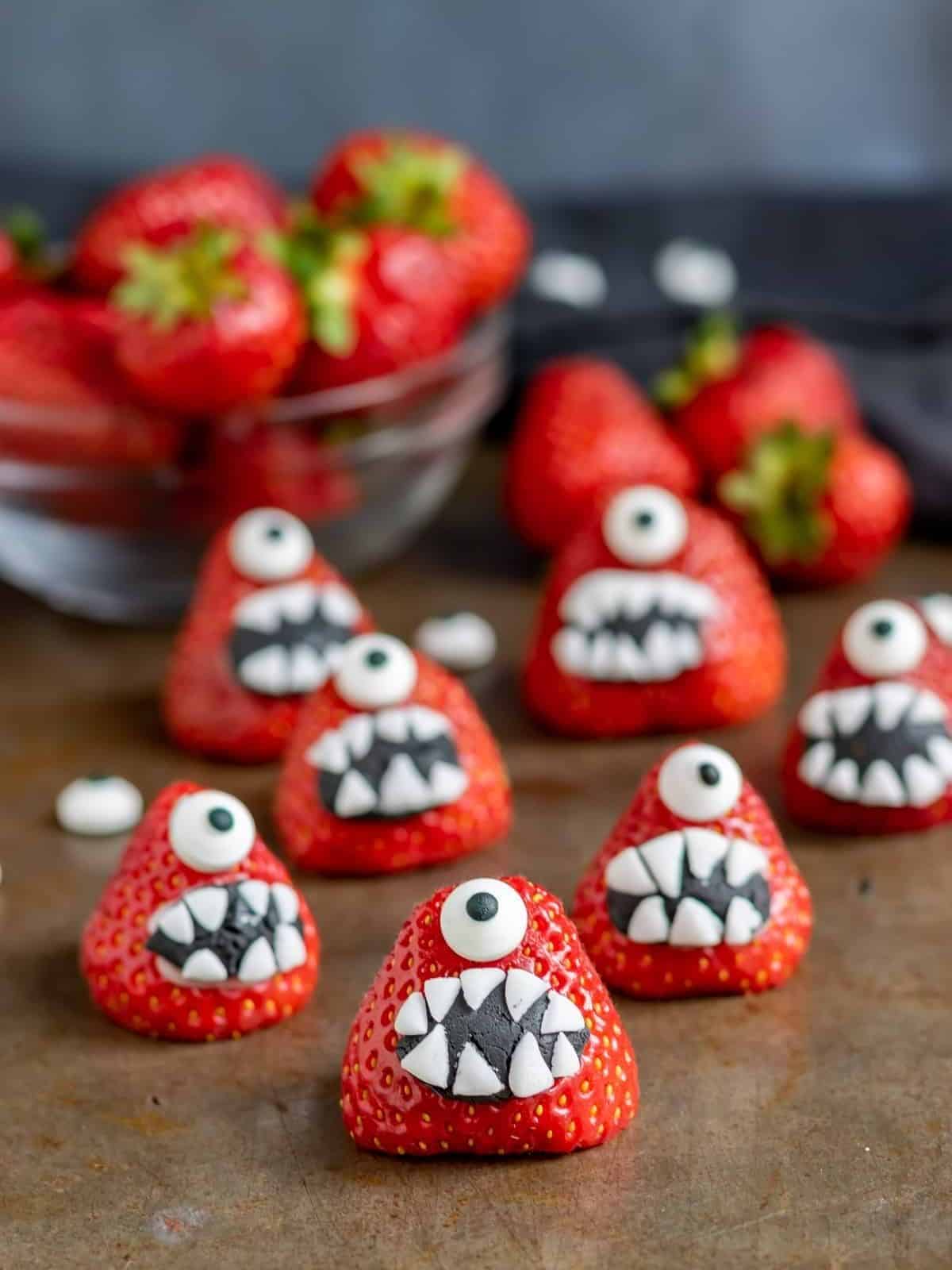 Fun Strawberry Halloween Monsters, a creative Halloween dessert idea with spooky, edible faces.