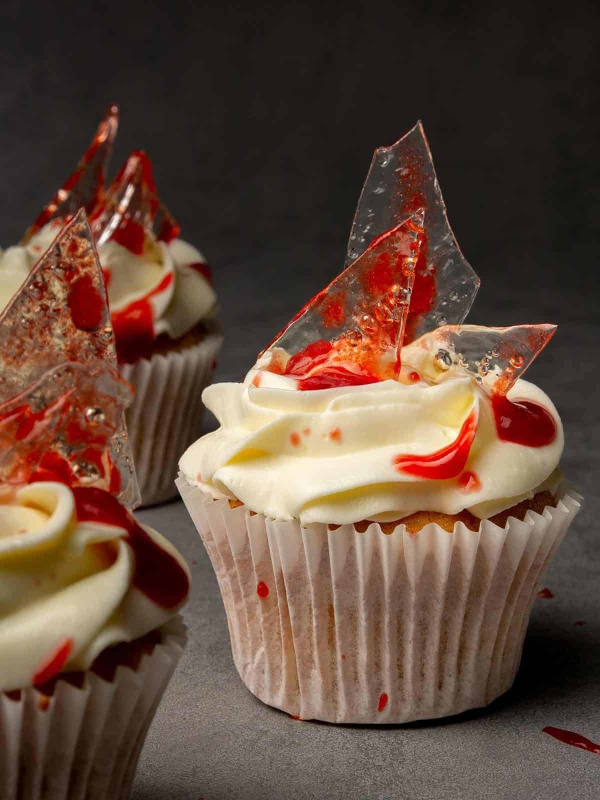 Bloody halloween cupcakes with glass shard candies. 