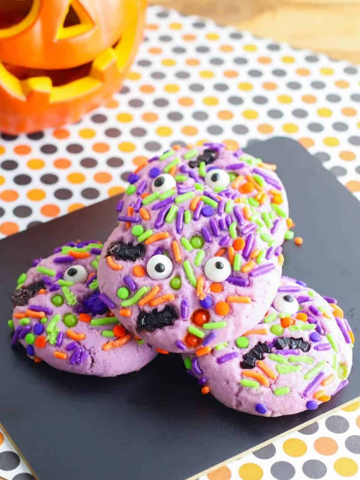 Halloween Monster Cookies decorated with candy eyes and spooky sprinkles, ideal for Halloween dessert ideas.