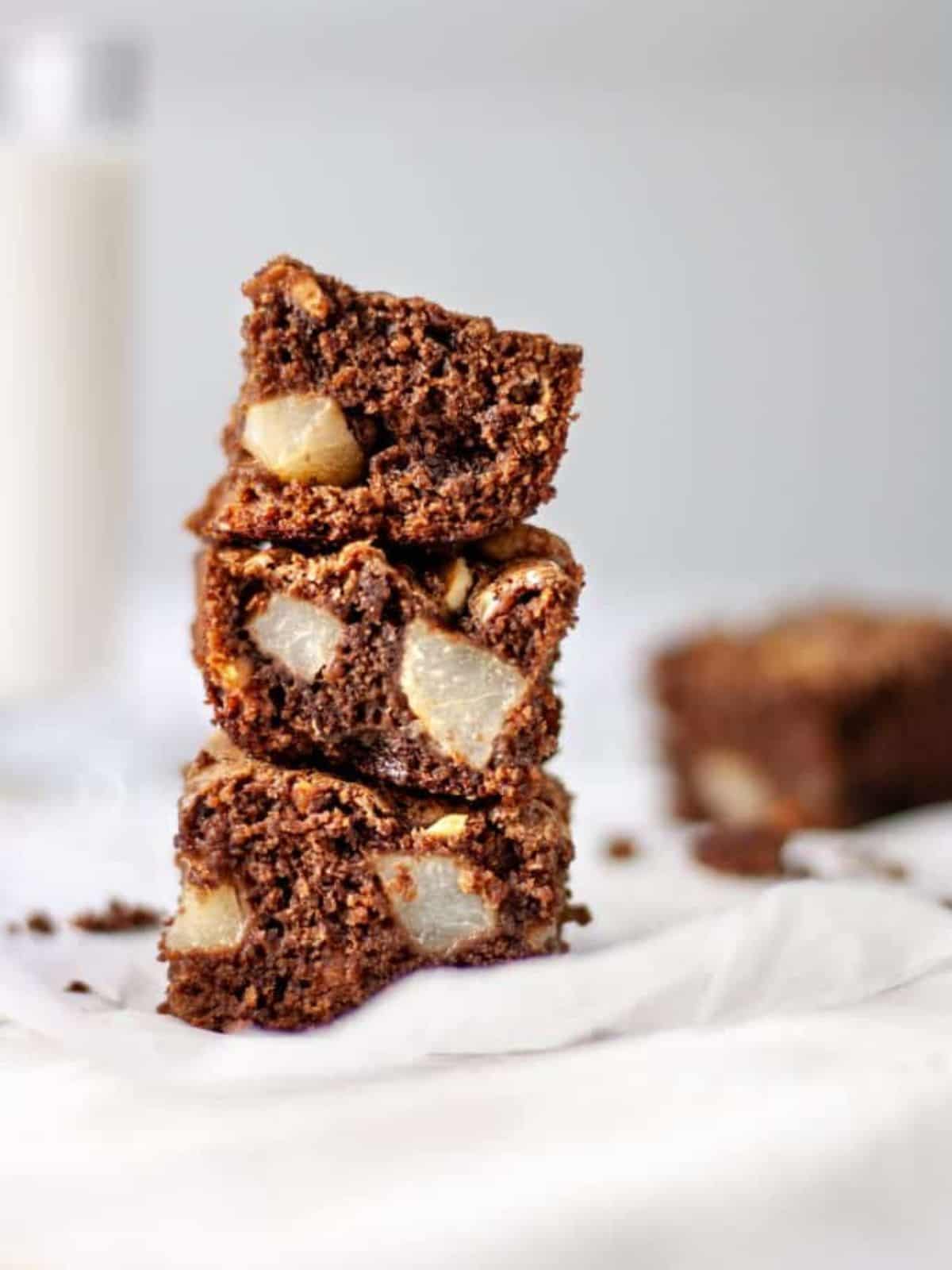 Stacked blocks of Pear and Hazelnut Brownies.