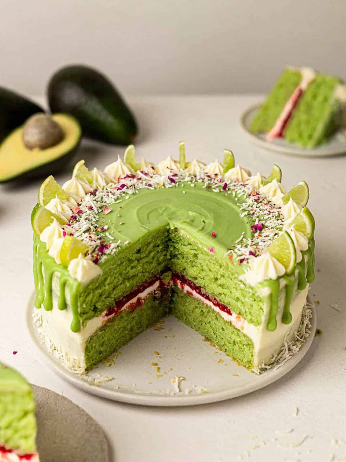 Vegan Avocado Lime Cake with avocado ganache, raspberry jam, and vanilla lime buttercream.