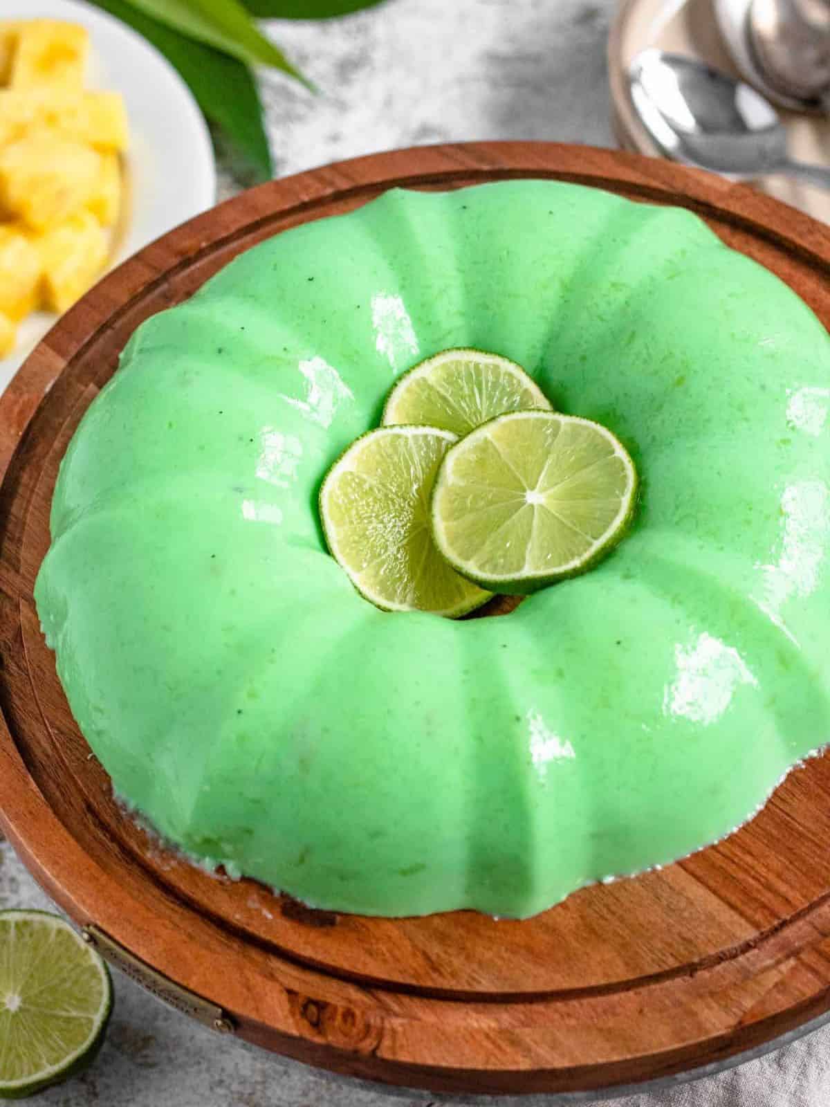 Lime Jello Salad With Cream Cheese and lime slices.