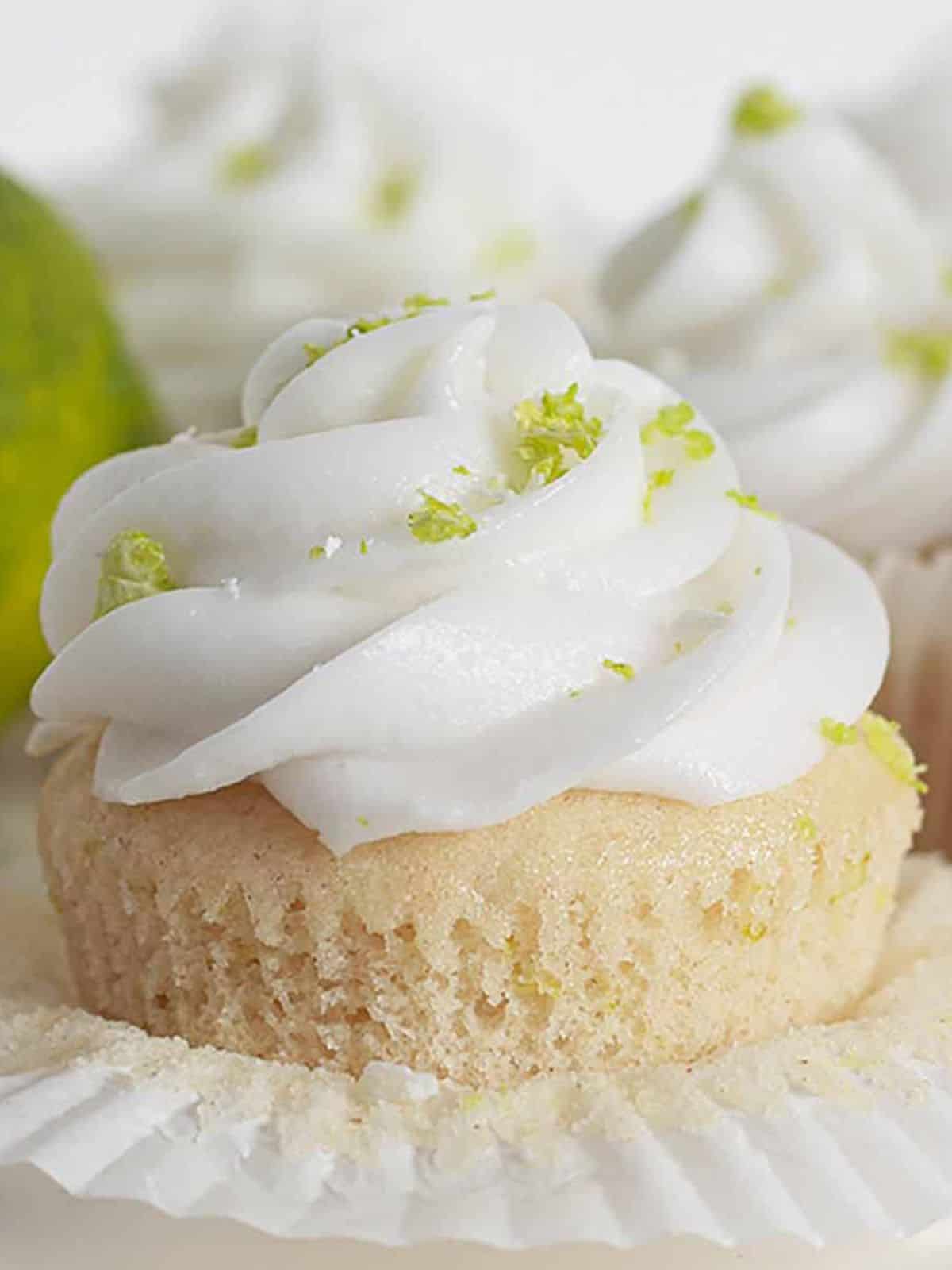 Vegan Coconut Lime Cupcakes with creamy frosting on top.