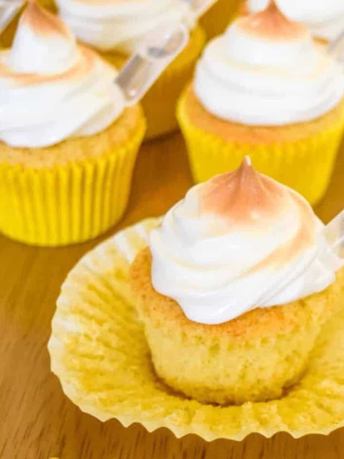 Lime pisco cupcakes with lime curd filling, Pisco sour-filled pipettes, and meringue topping.