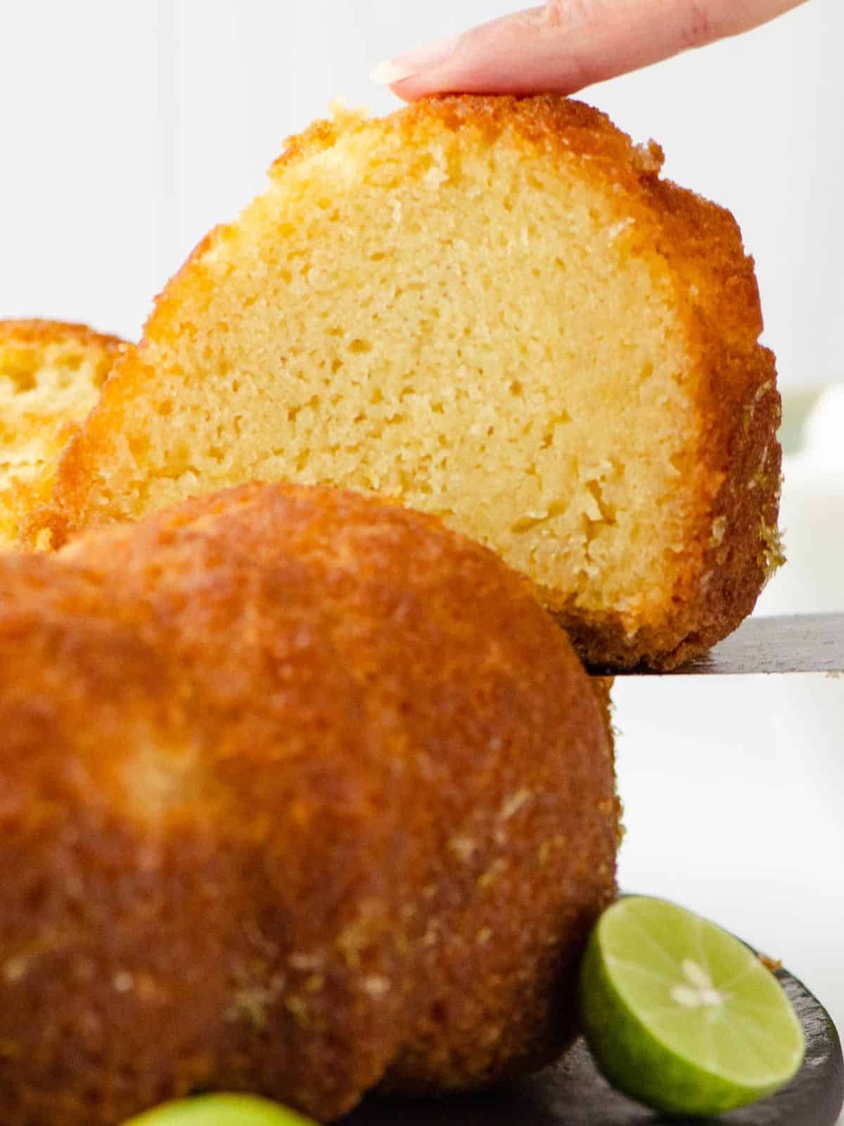 a slice of Key Lime Cake With Rum – A vibrant, zesty cake featuring lime and rum, perfect for lime dessert lovers.