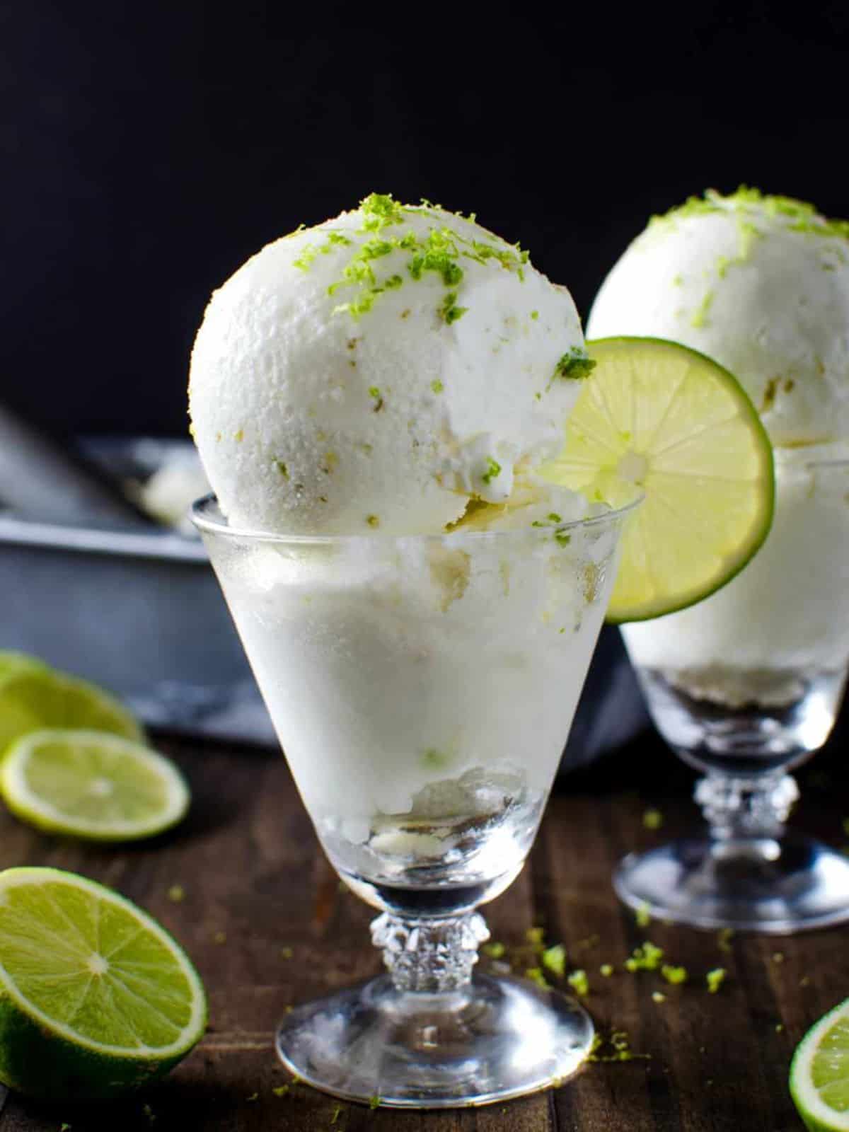 Salted Lime Sorbet topped with lime zest and sliced lime.