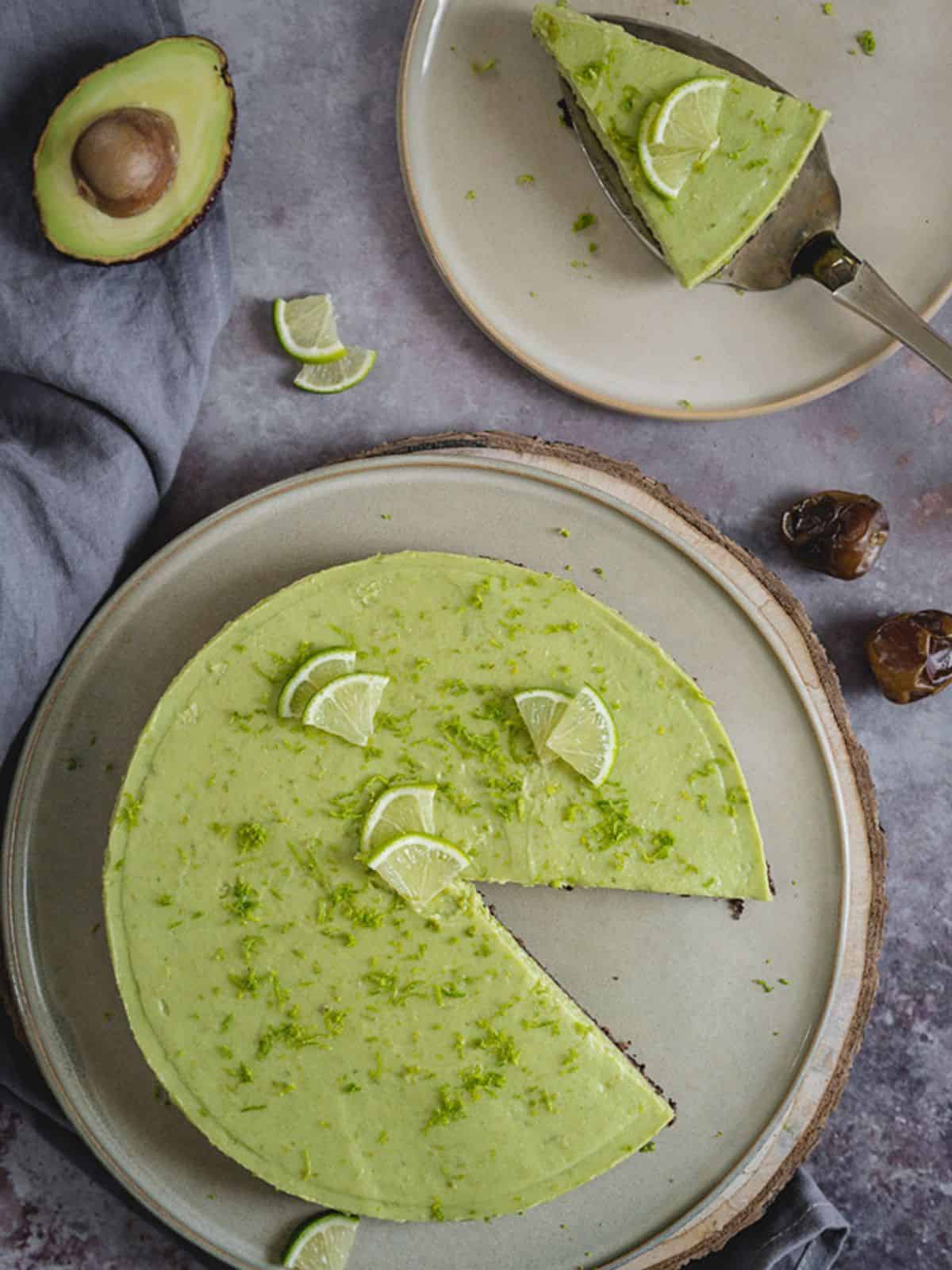 Avocado Lime Cheesecake topped with lime slices.
