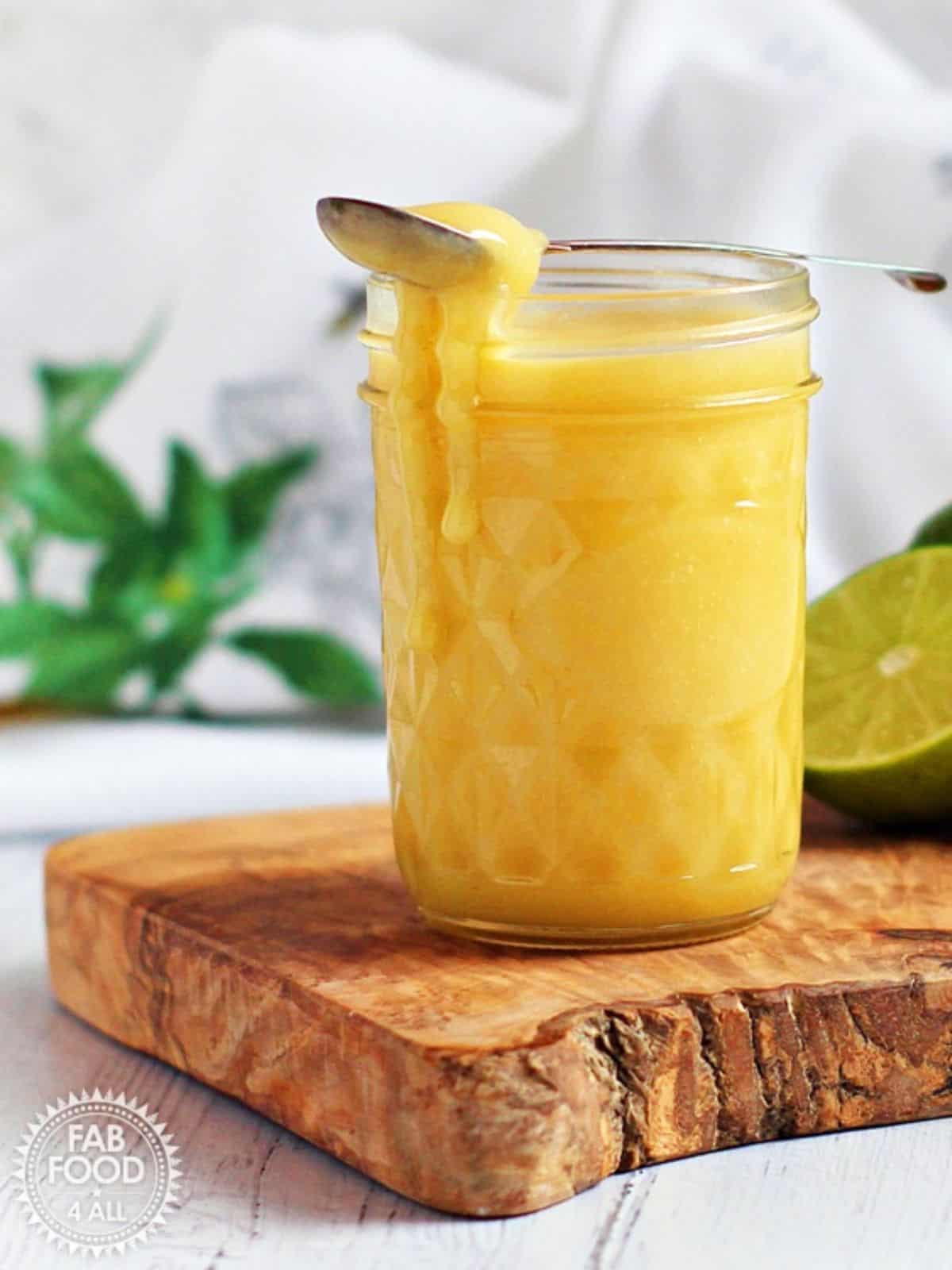 Lime Curd in a glass jar.