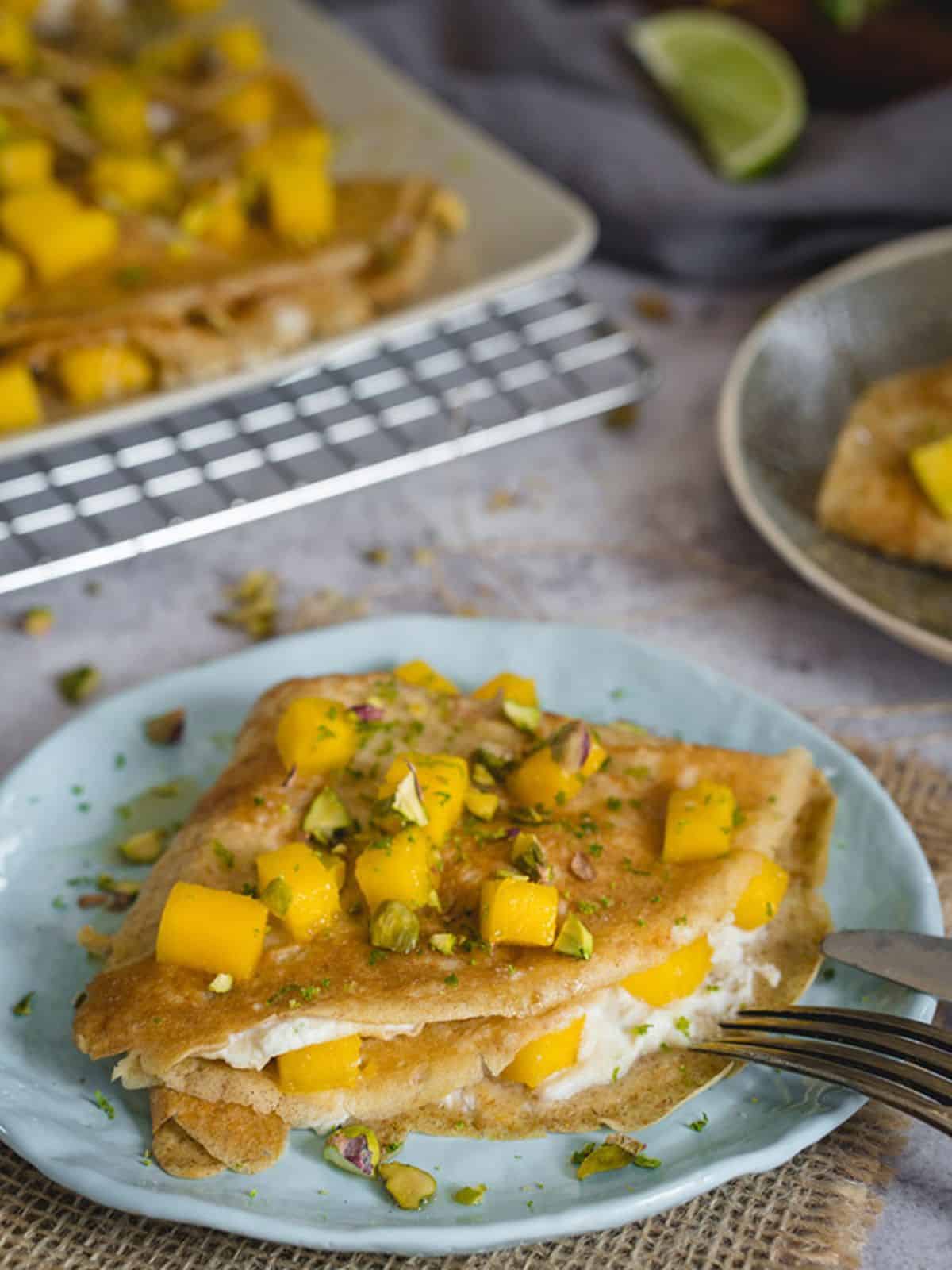 Mango Crepes with maple-lime ricotta filling.