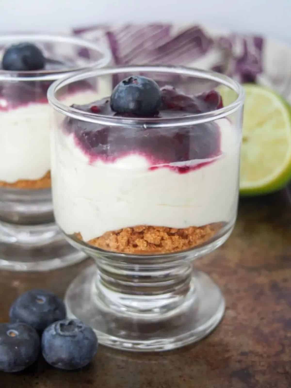 Lime Mascarpone Cheesecake topped with blueberries.