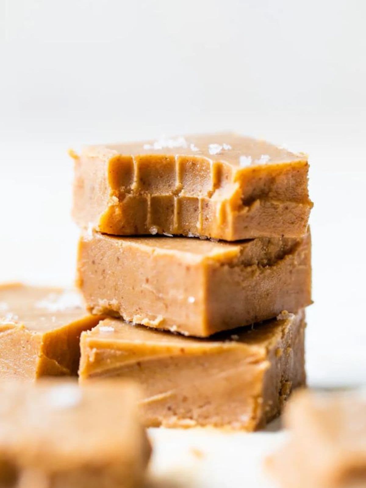 Stacked blocks of Dairy-Free Peanut Butter Fudge.