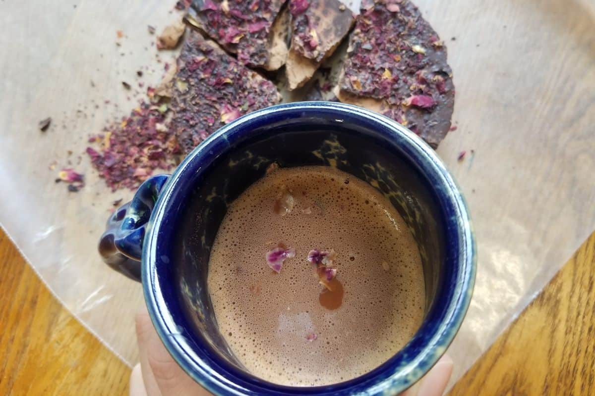 ceremonial cacao in a cup with chopped up cacao