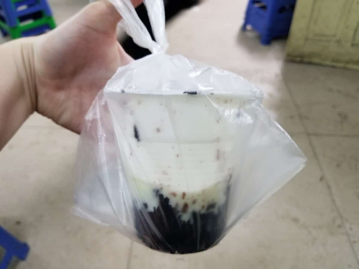 Sữa Chua Nếp Cẩm, or black sticky rice with sweet yogurt.