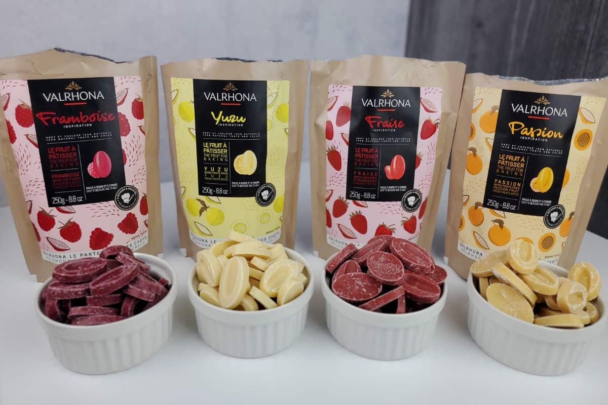 four flavors of cocoa butter-based fruit callets in raspberry, yuzu, strawberry, and passion fruit flavors.
