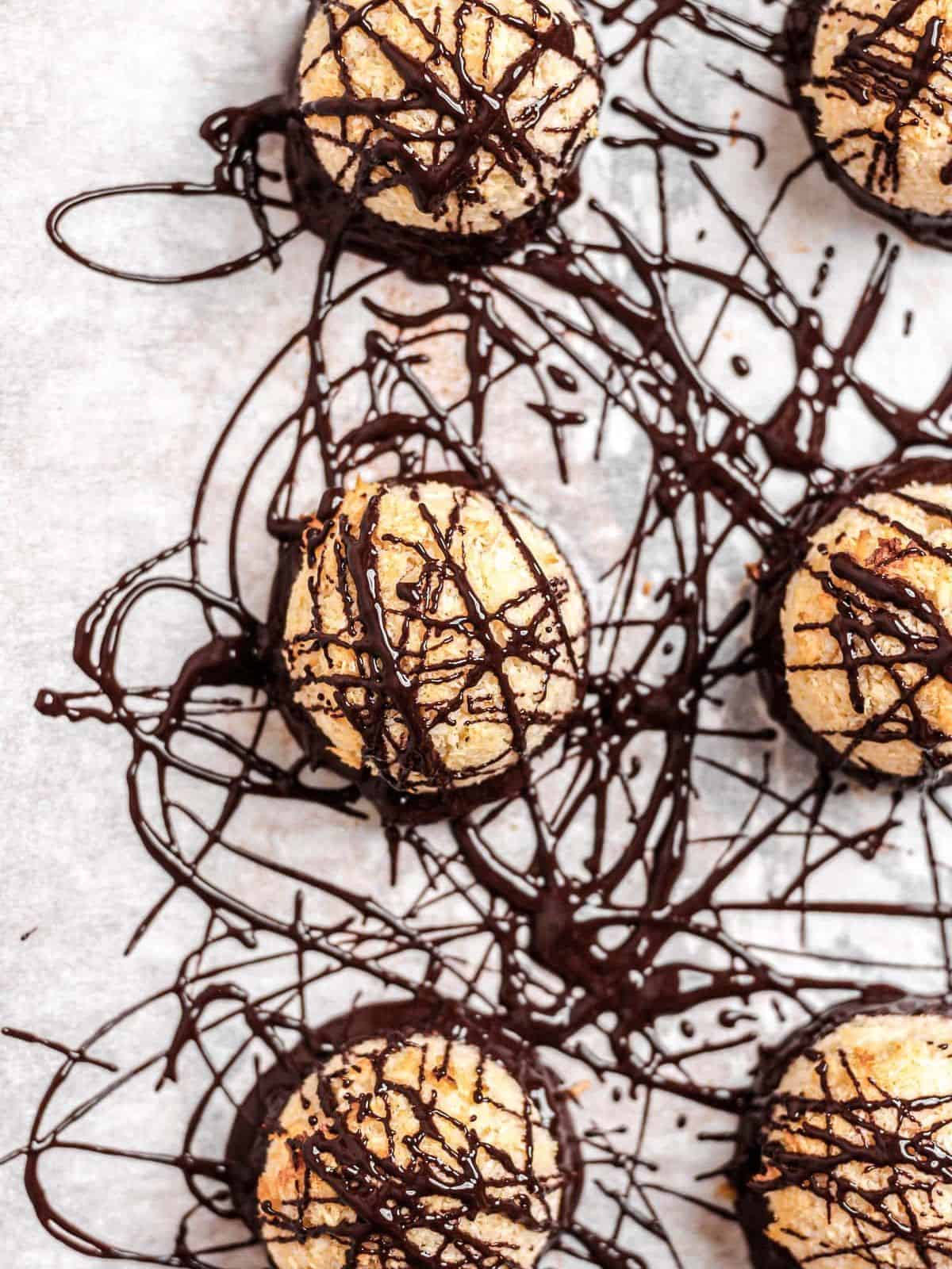 Coconut Macaroons dipped in rich, velvety dark chocolate and then drizzled with more chocolate on top