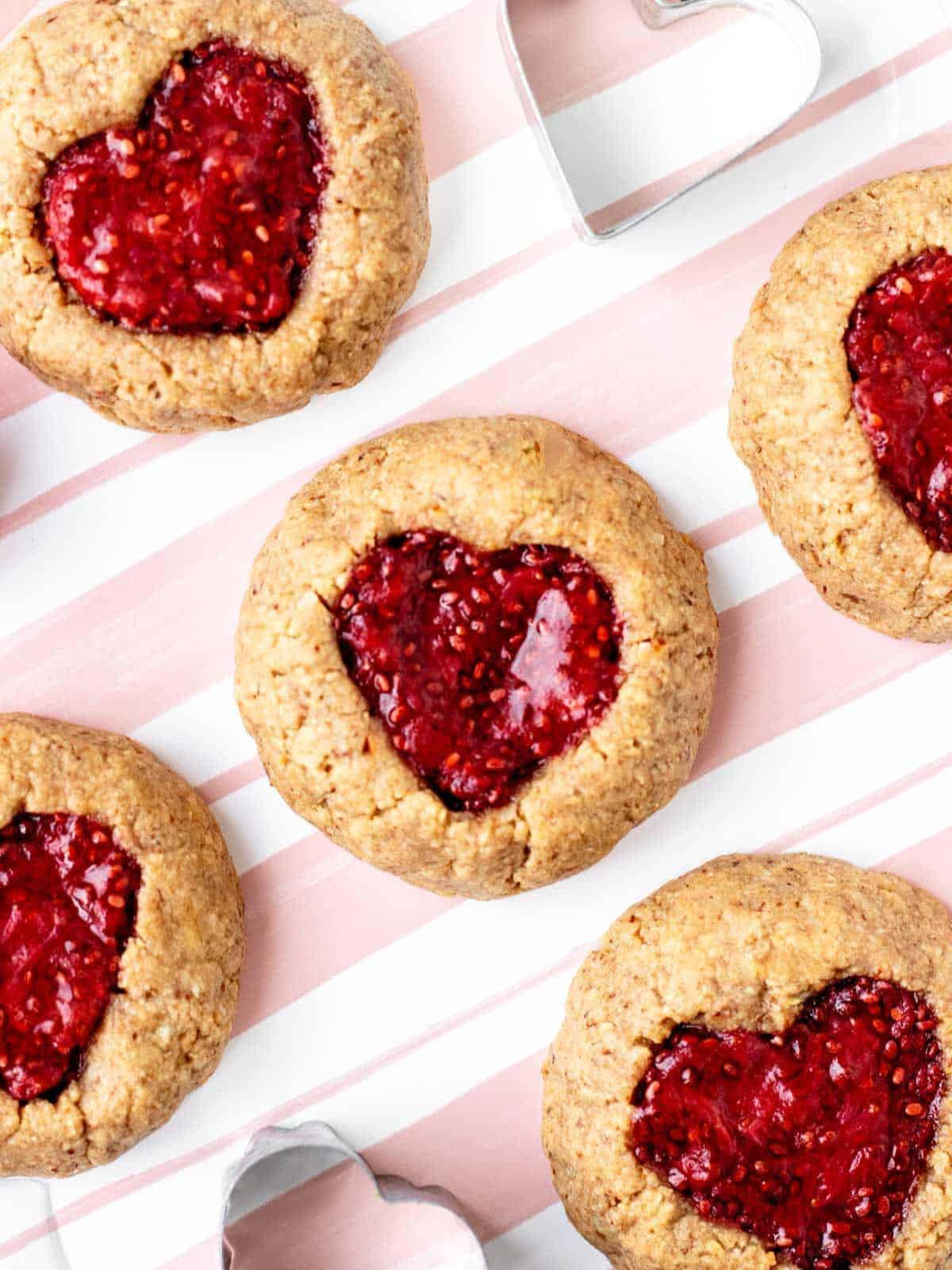 Adorable heart thumbprint shortbread cookies with a delicious strawberry chia jam center
