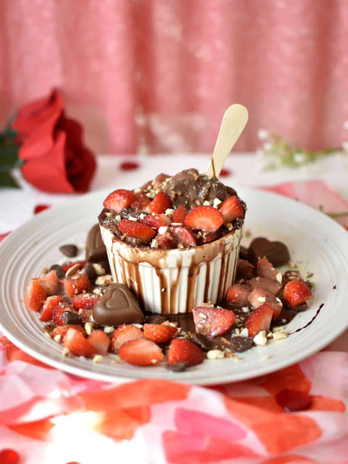 Molten Chocolate Souffle topped with Fresh Strawberries and then inserted with an ice cream bar