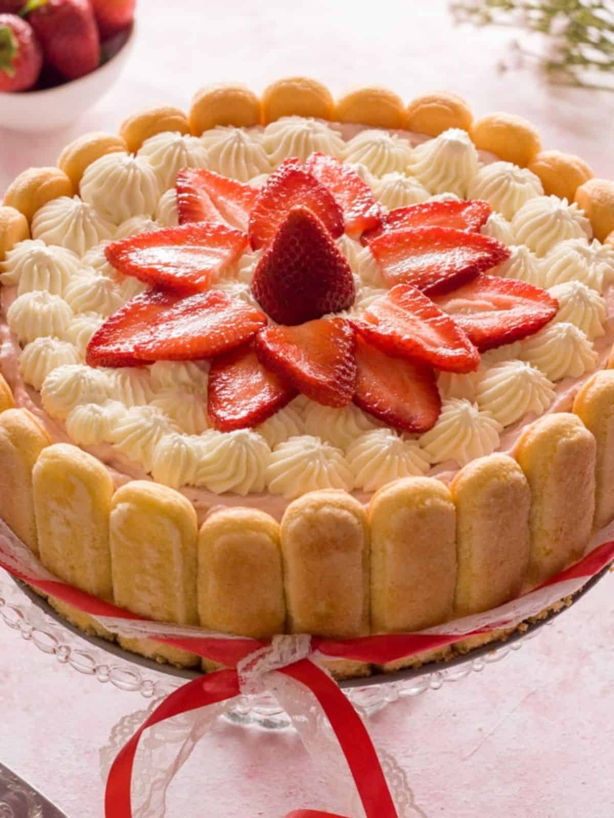 Fresh Strawberry Cream encased with Lady Fingers and topped with Fresh Strawberry Slices