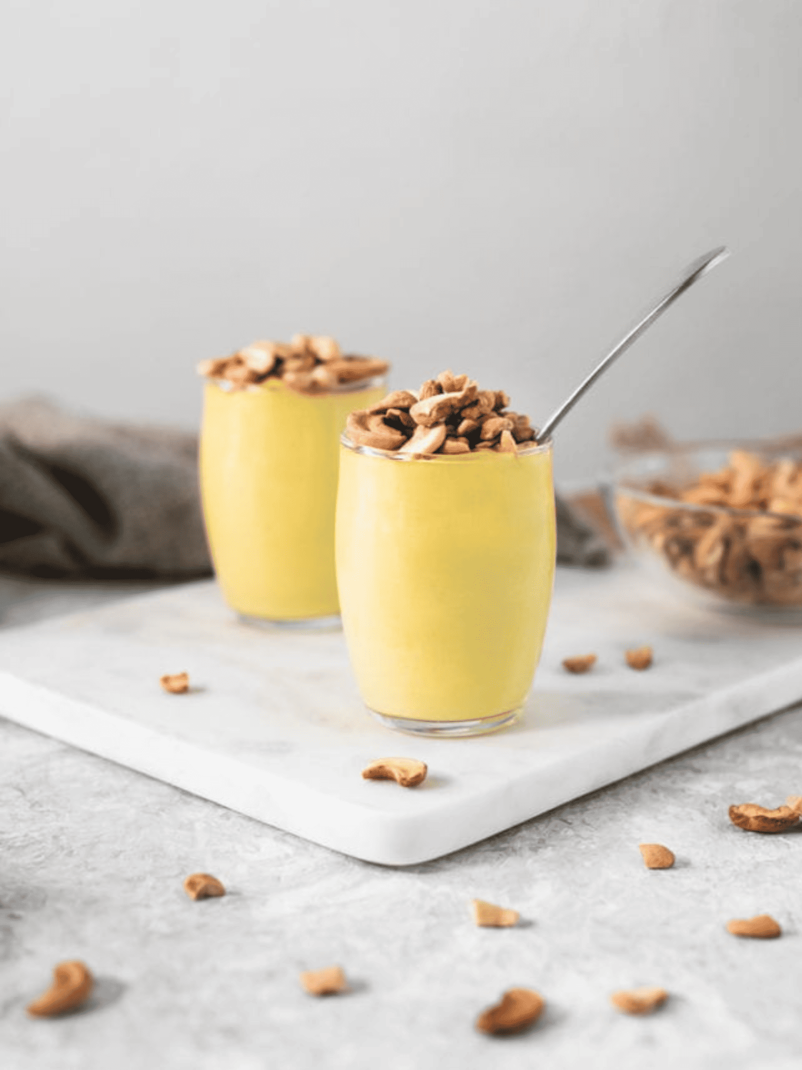 delicious banana cream turmeric pudding served in a glass bowl.