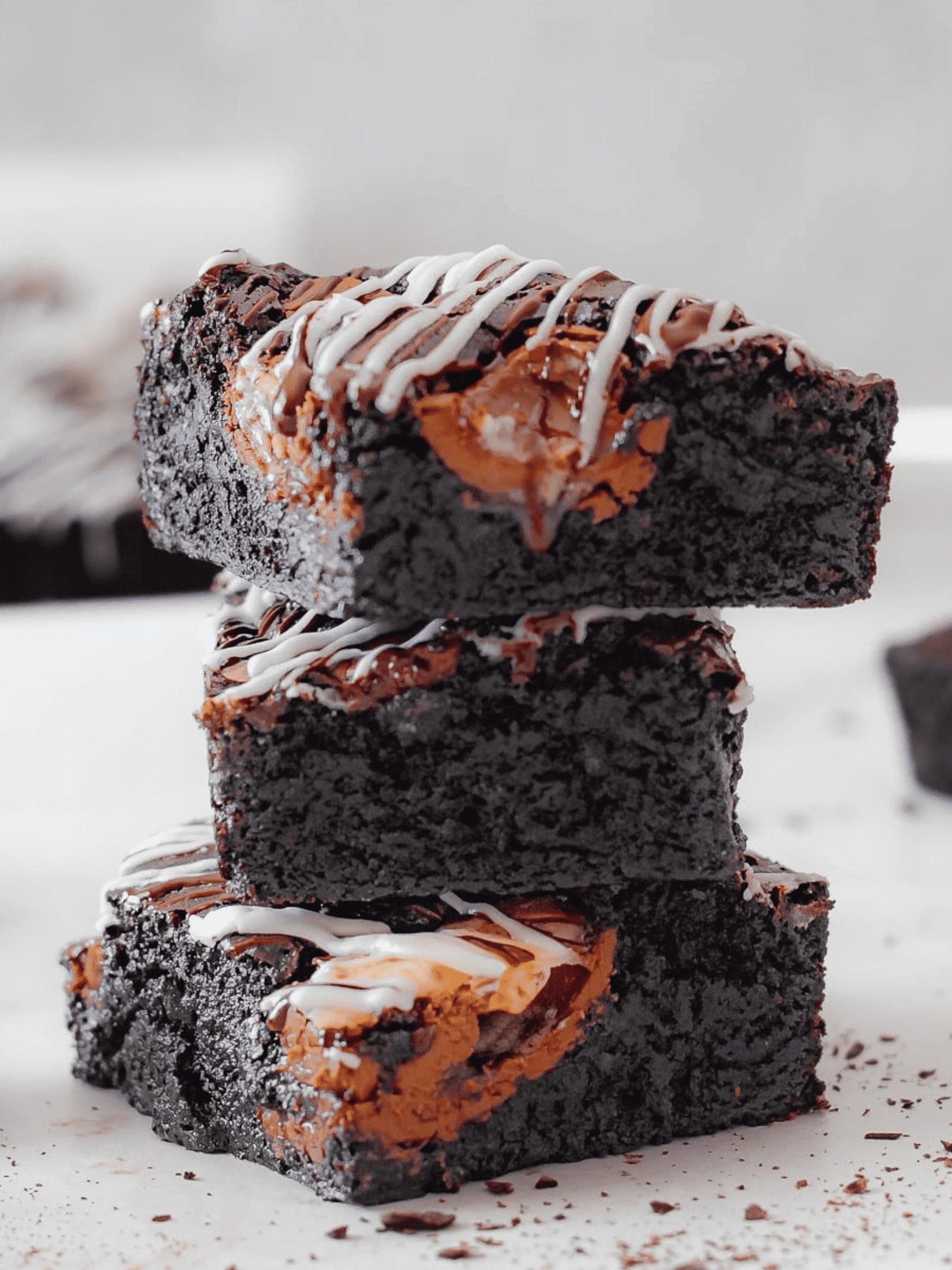 a decadent creme egg brownies, showcasing rich chocolatey layers with gooey creme egg centers.