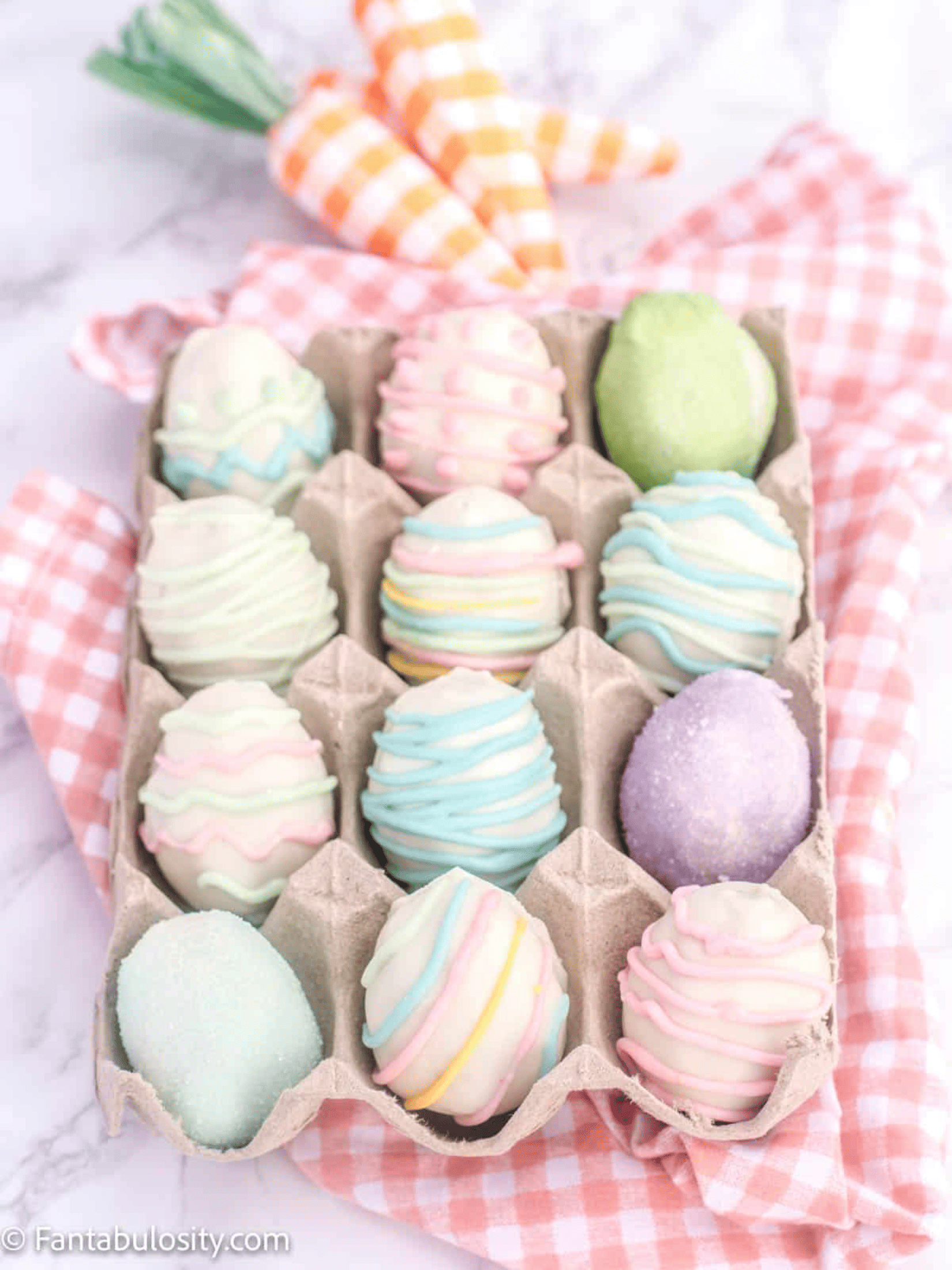 assortment of Easter-themed truffles in pastel colors.
