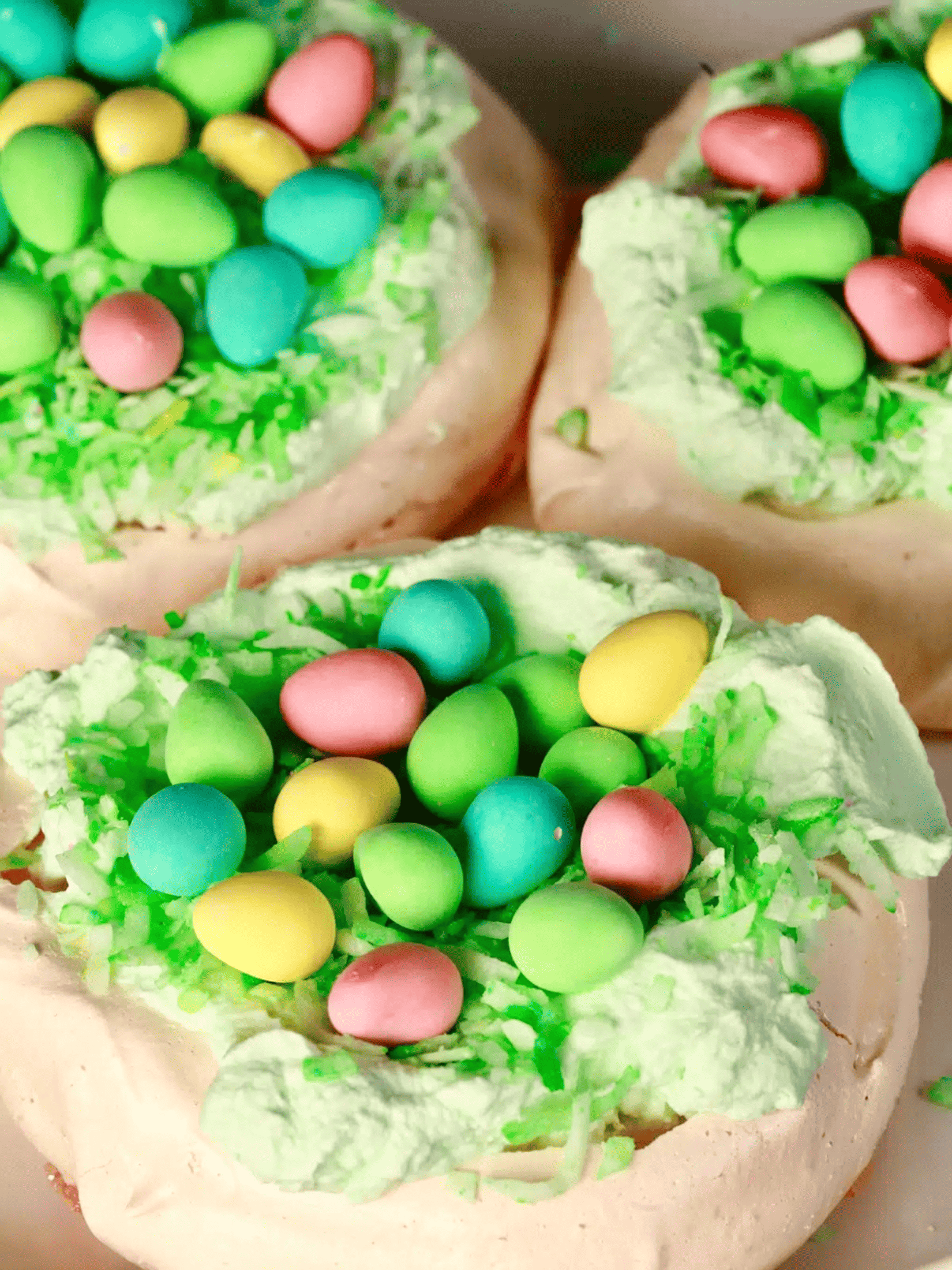 an exquisite Easter pavlova adorned with vibrant pastel-colored eggs.