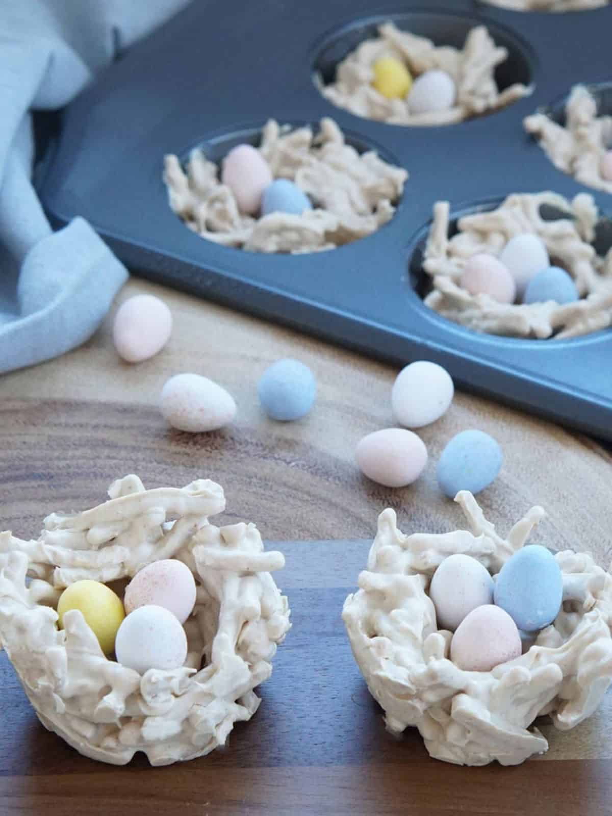 colorful peanut butter easter eggs arranged in a nest.