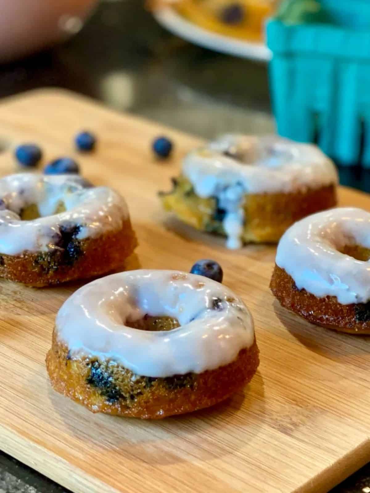 delicious blueberry donuts with a tantalizing lemon glaze and fresh blueberries.