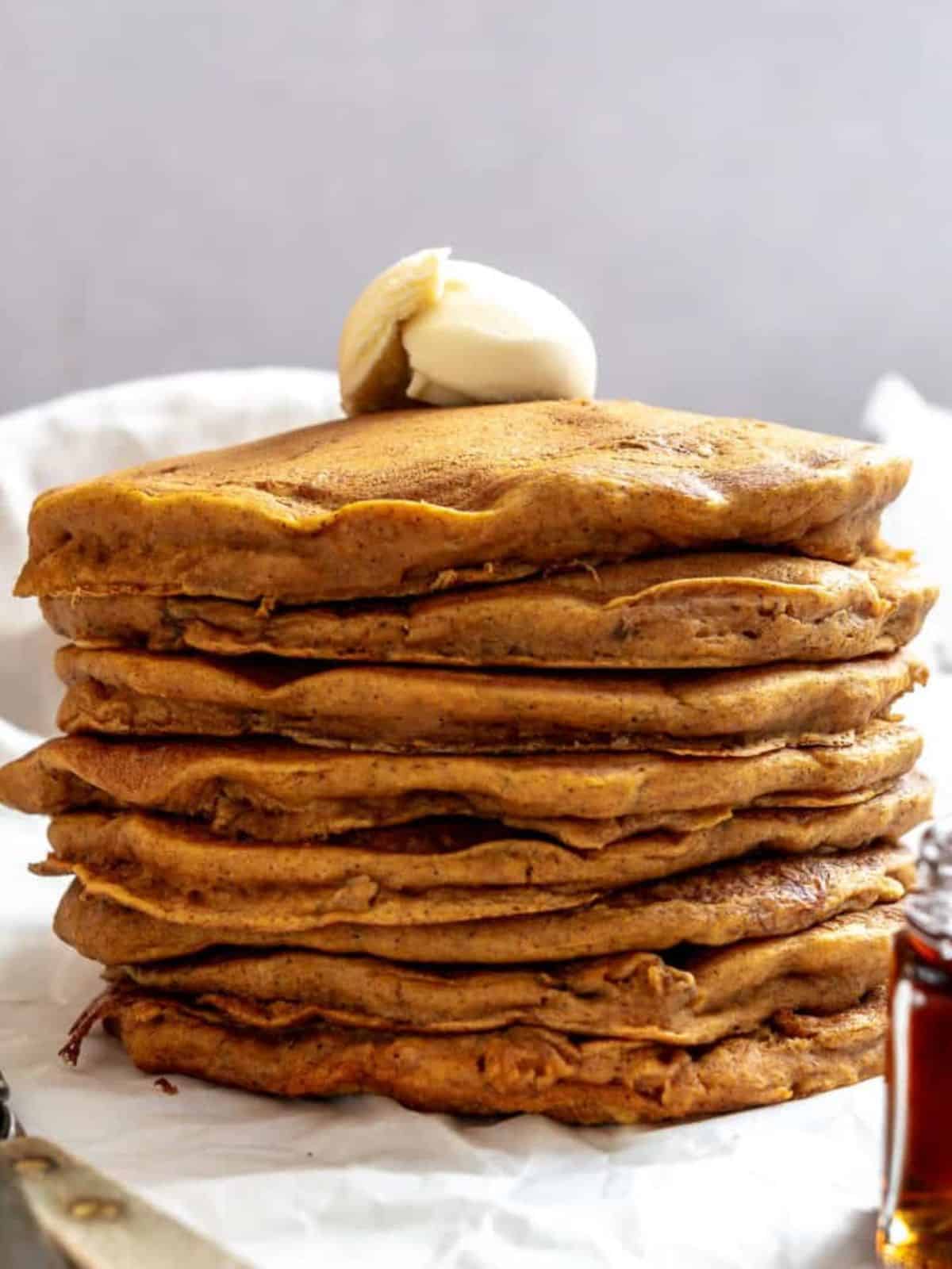 stack of golden brown vegan sweet potato pancakes.