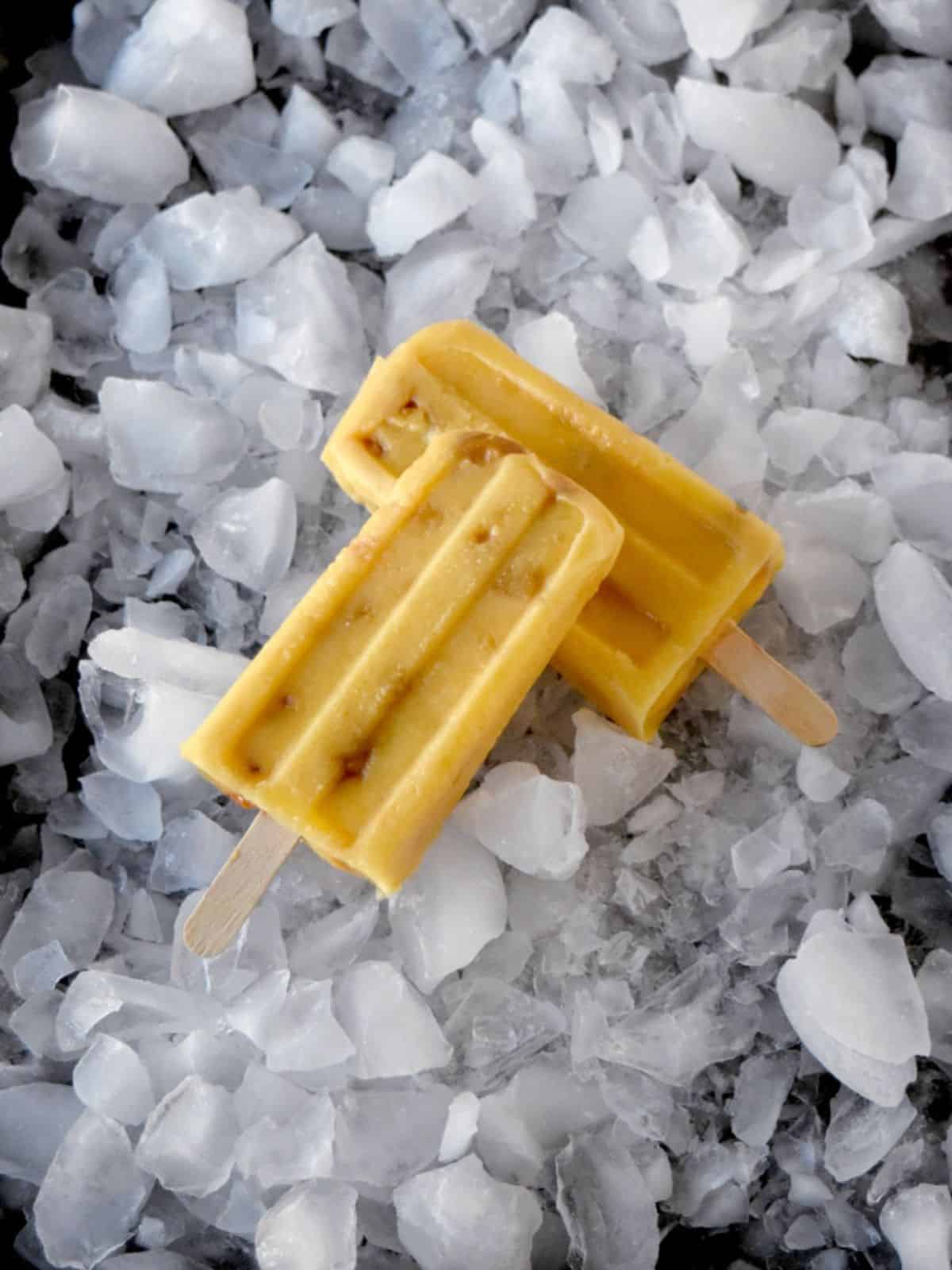 mango macadamia nut popsicles full of sweet mango, creamy yogurt, mango juice, and macadamia nuts.