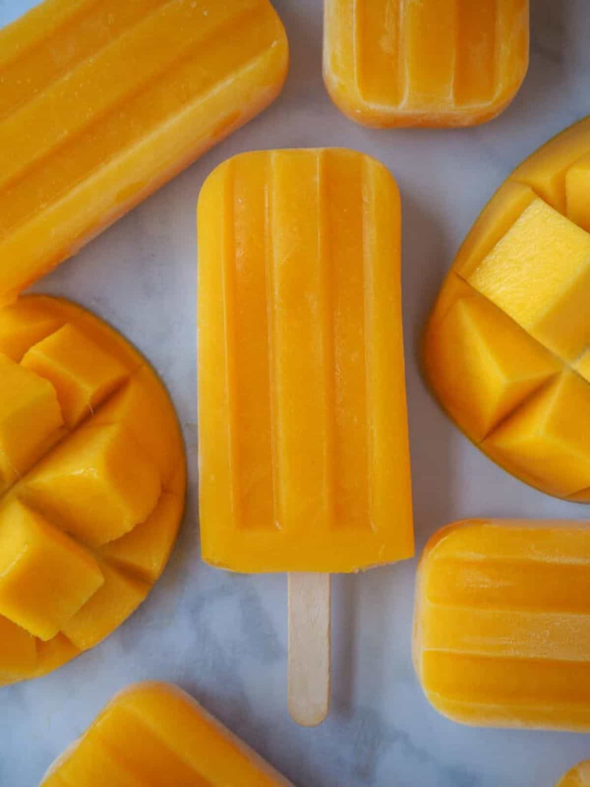 vibrant mango popsicles that are full of fresh tropical mango flavor.