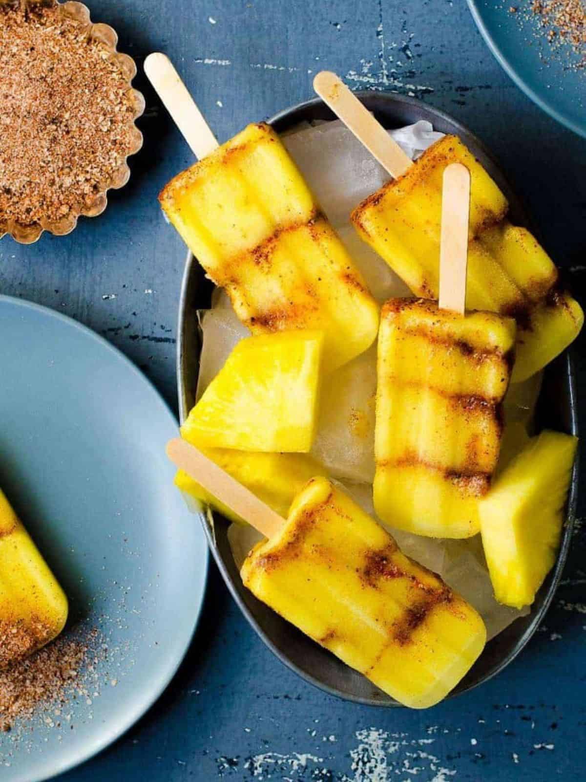 refreshing spicy pineapple popsicles layered with spicy, salty spice mix.