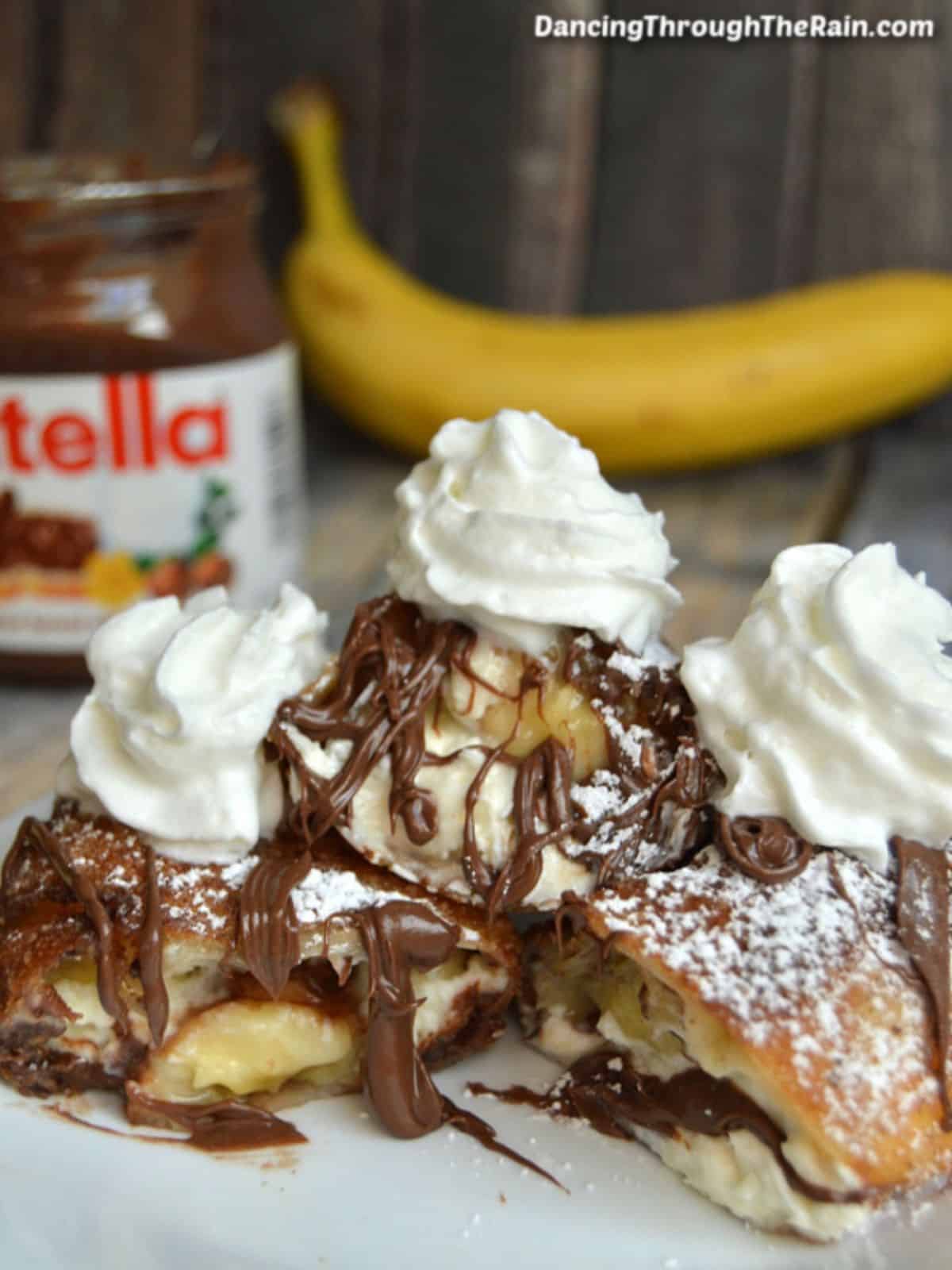 fried banana Nutella cheesecake egg rolls made with a basic egg roll wrapper that is stuffed with banana, cheesecake filling, and Nutella spread.