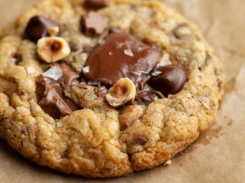Nutella chocolate chip cookies filled with Nutella spread and topped with homemade Nutella chips.