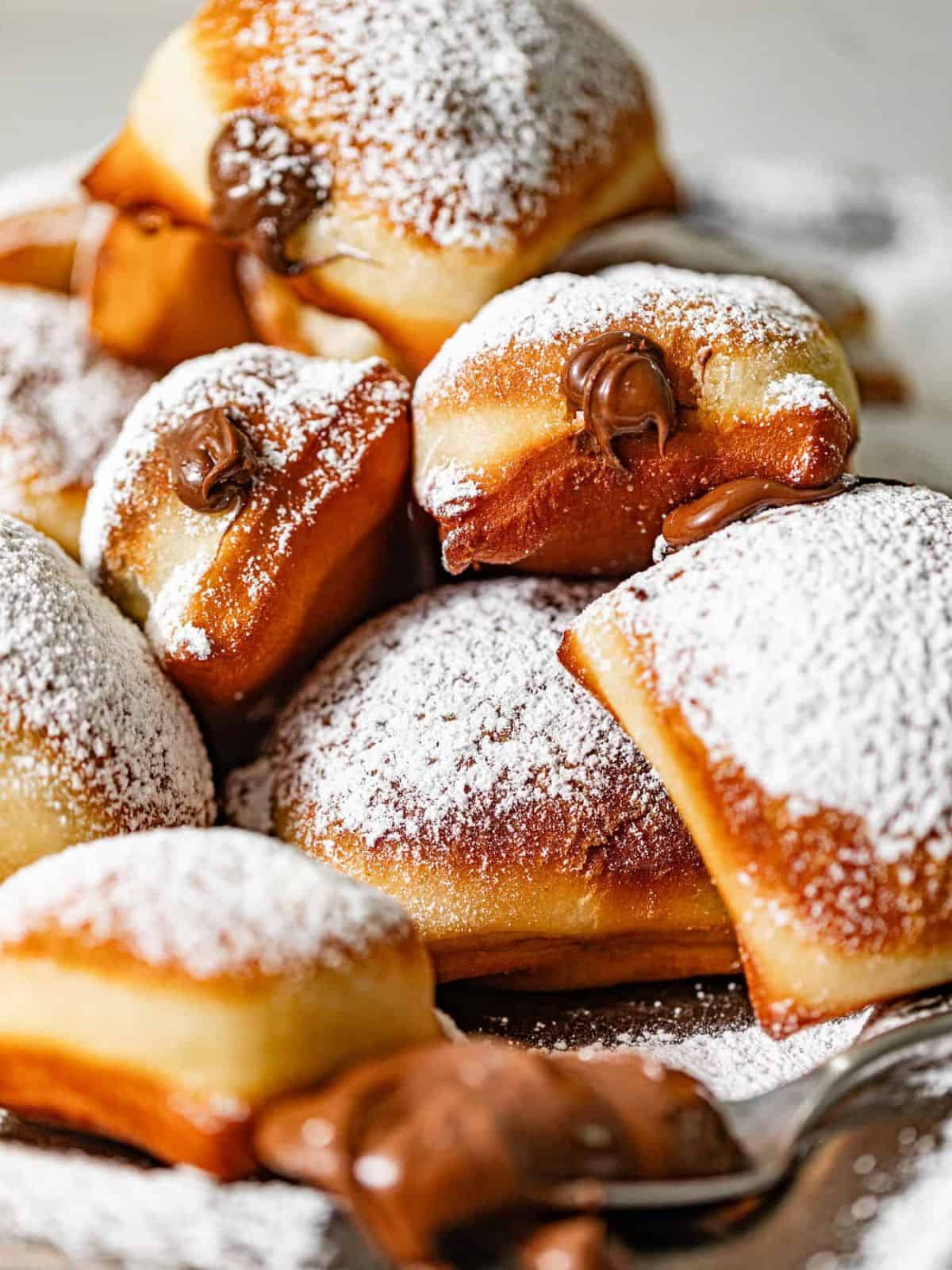 sugary sweet fried pieces of beignets stuffed with creamy Nutella.