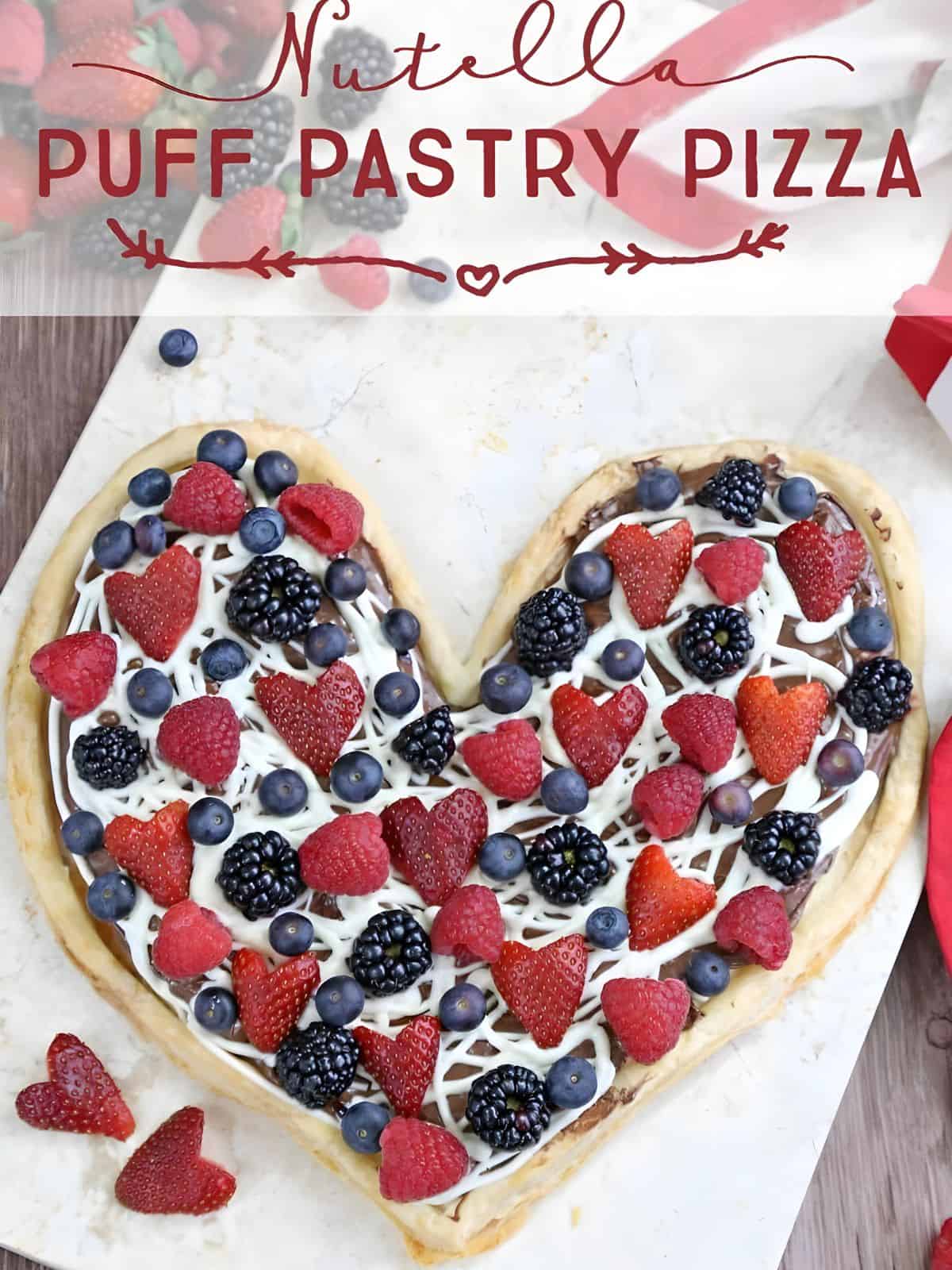 Nutella puff pastry pizza made with buttery puff pastry crust topped with Nutella, melted white chocolate, and fresh berries.
