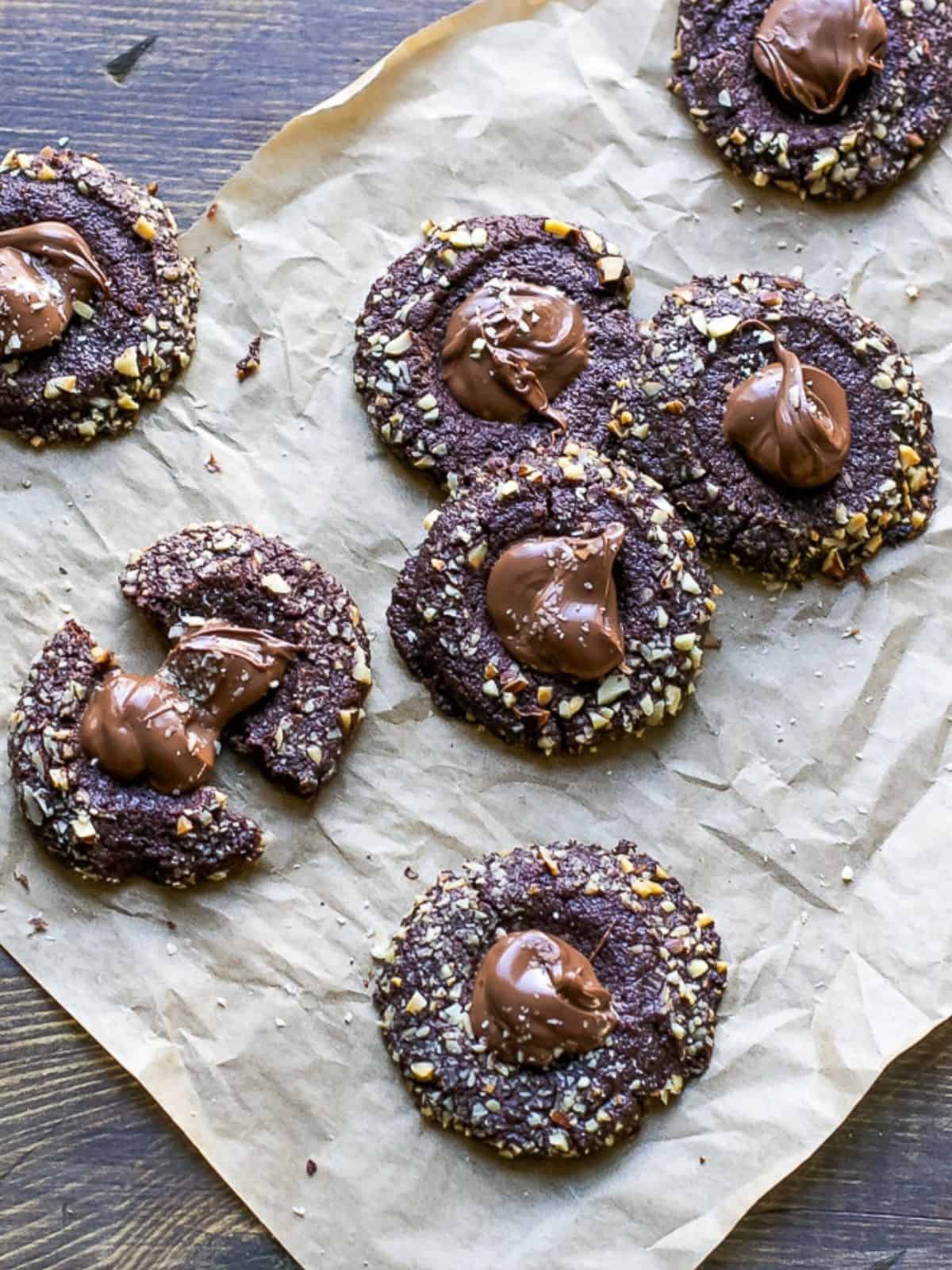 chocolate shortbread Nutella thumbprint cookies made with creamy Nutella spread, baked hazelnuts, and Nutella spread.