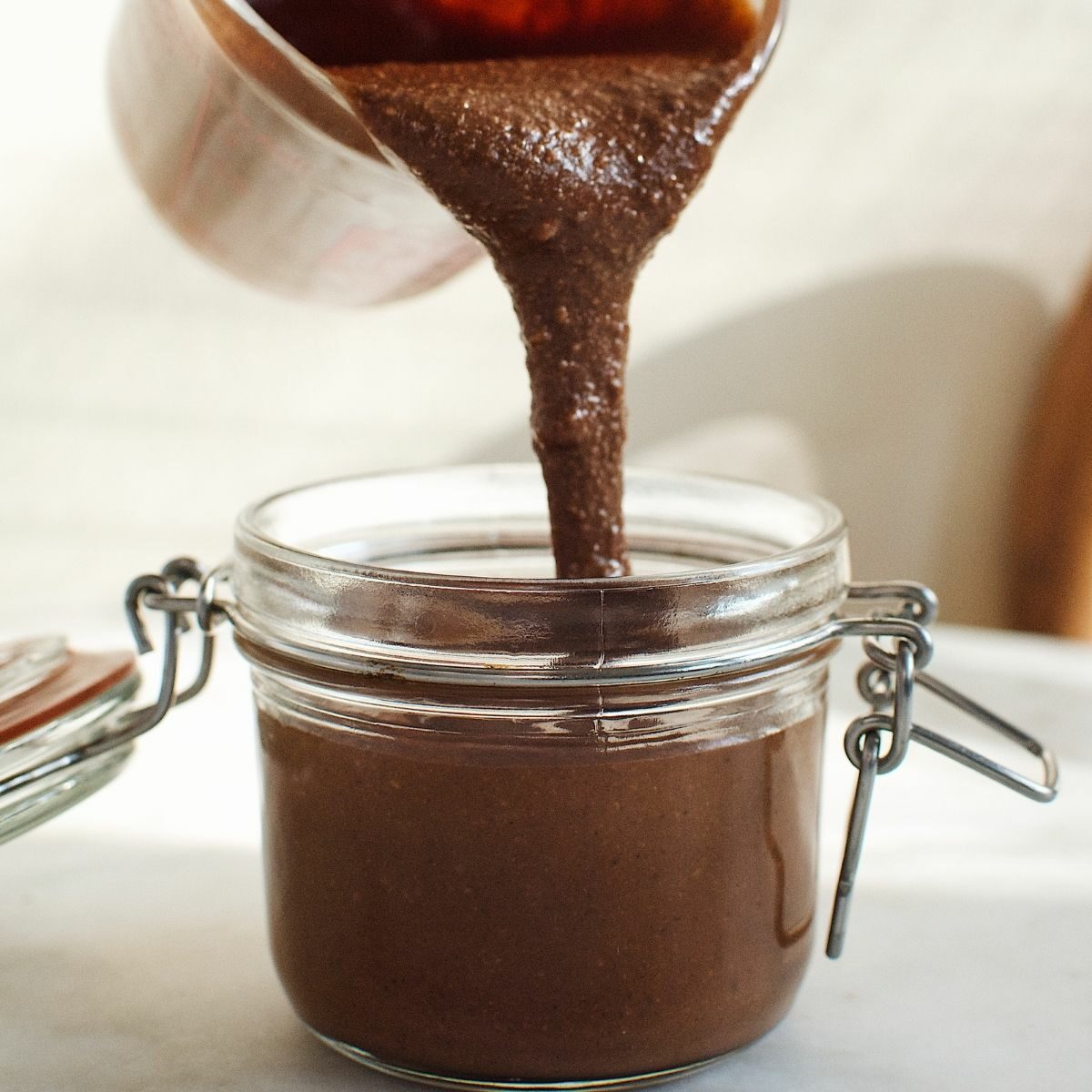 Gianduja being poured in a jar.